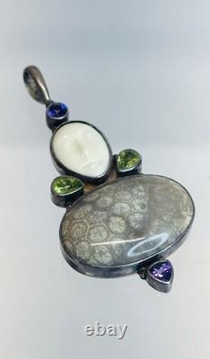 Vintage Sterling Silver Fossilized Coral Pendant Carved Face Peridot Amethyst