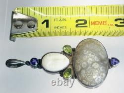 Vintage Sterling Silver Fossilized Coral Pendant Carved Face Peridot Amethyst