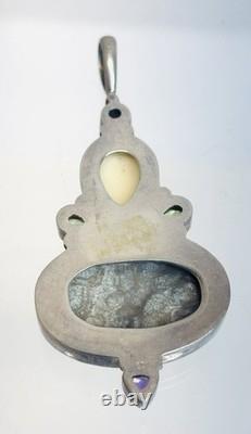 Vintage Sterling Silver Fossilized Coral Pendant Carved Face Peridot Amethyst