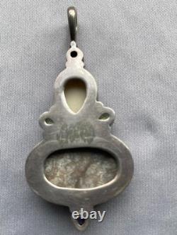 Vintage Sterling Silver Fossilized Coral Pendant Carved Face Peridot Amethyst