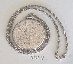 Vintage sterling silver Large round locket pendant with engraved floral design Vintage sterling silver Large round locket pendant with engraved floral design