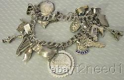 Vtg STERLING SILVER CHARM BRACELET 20P loaded Eiffel Tower bee kiss shoe key 52g