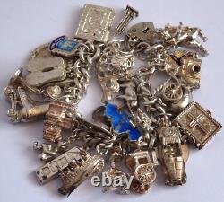 Bracelet de charme vintage en argent massif lourd avec 30 charms en argent, articulé, rare