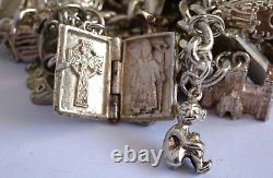 Bracelet de charme vintage en argent massif lourd avec 30 charms en argent, articulé, rare