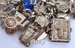 Bracelet de charme vintage en argent massif lourd avec 30 charms en argent, articulé, rare