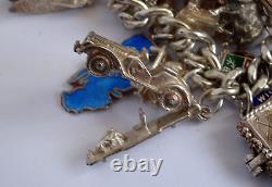 Bracelet de charme vintage en argent massif lourd avec 30 charms en argent, articulé, rare