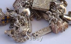 Bracelet de charme vintage en argent massif lourd avec 30 charms en argent, articulé, rare