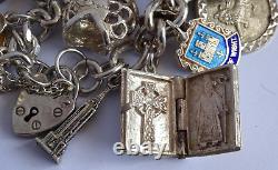 Bracelet de charme vintage en argent massif lourd avec 30 charms en argent, articulé, rare