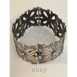 Bracelet vintage en argent sterling mexicain avec charnière, design floral découpé, en excellent état d'usage.