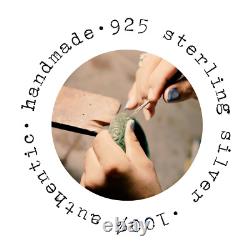 Broche vintage en argent sterling 925 avec design de nœud et émeraude synthétique